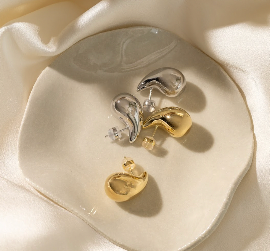 silver and gold teardrop studs